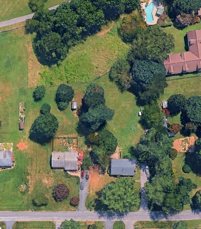 Raw aerial photo of the Lot 75 parcel before development